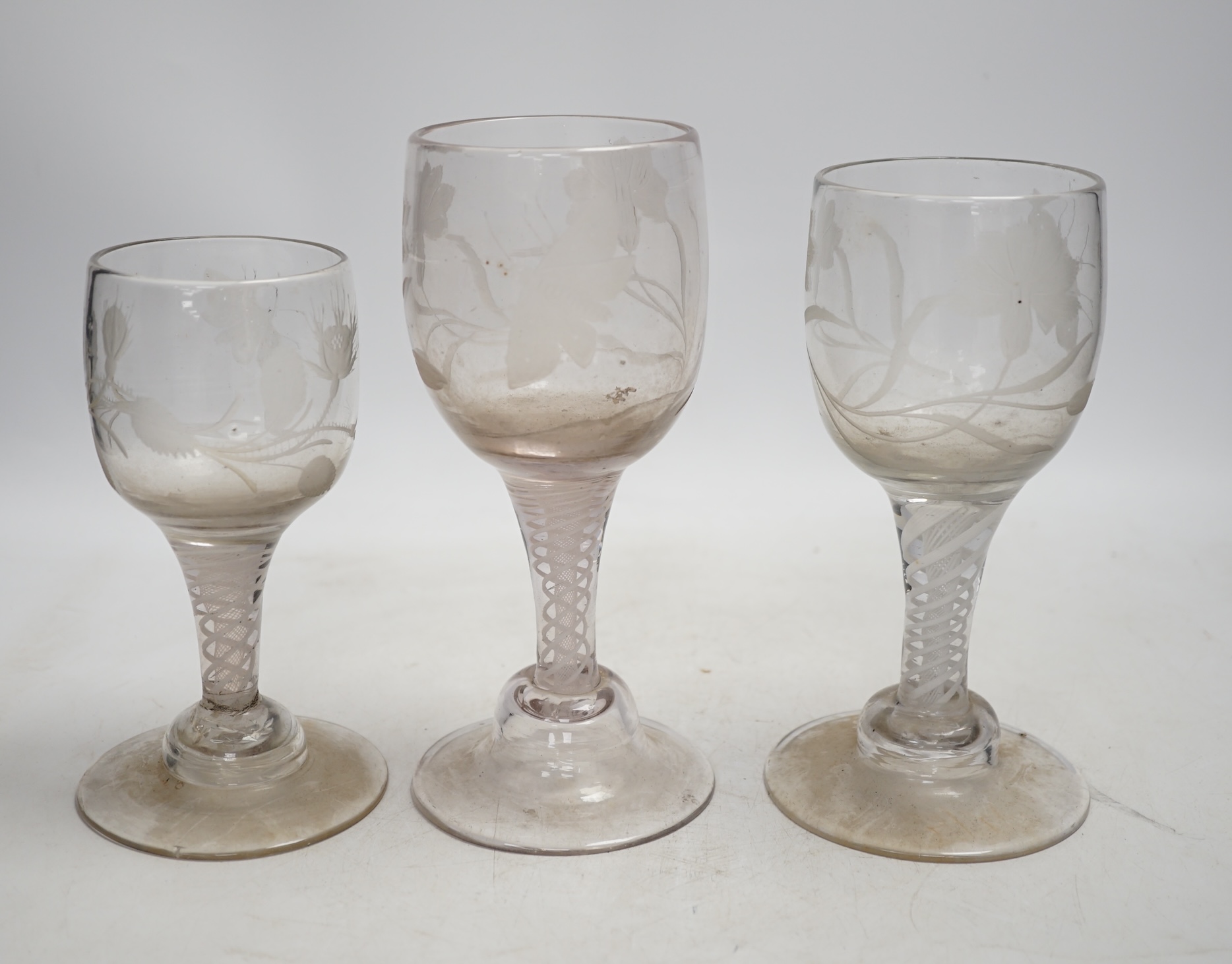 A group of three Dutch engraved wine glasses, in Jacobite style, tallest 19cm. Condition - fair to good, would benefit from a clean